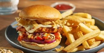 Photo of Tex Mex Chicken Burger on a plate with fries