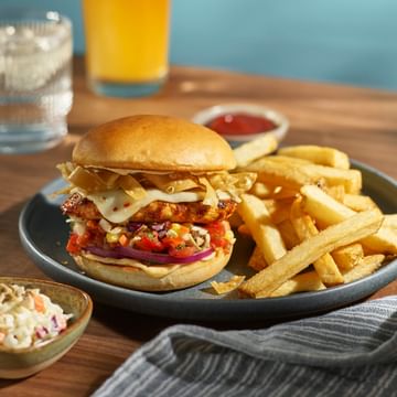 Photo of Tex Mex Chicken Burger on a plate with fries