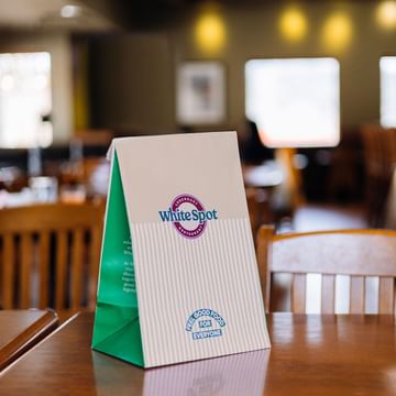Photo of our takeout bag sitting on a table