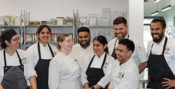 Group photo of our red seal chefs inside our home office kitchen.